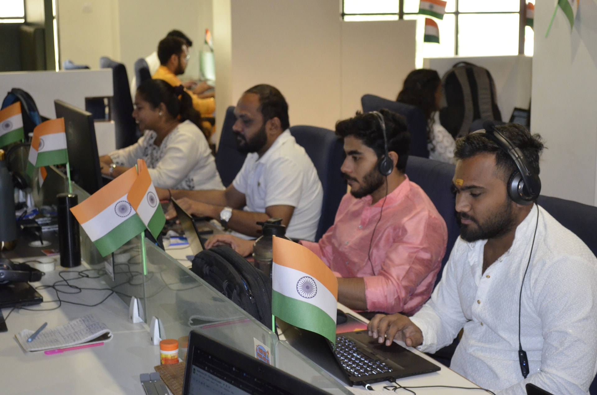 Zealousians celebrating in an office decorated for August 15th